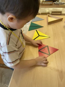 MLI Kid with Montessori Materials - Constructive Triangles