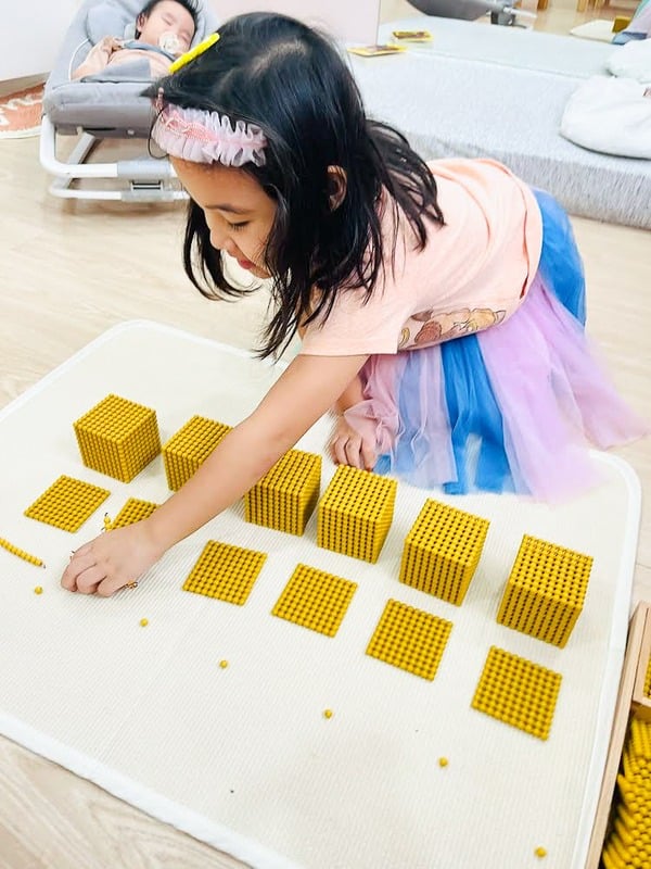 MLI kid with math beads MLI kid with math beads